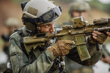 Portrait of a ranger in the battlefield with a gun