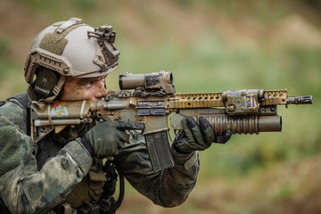 Portrait of a ranger in the battlefield with a gun