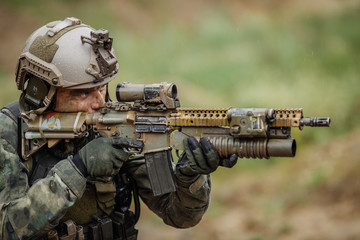 Portrait of a ranger in the battlefield with a gun