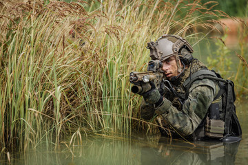 Portrait of a ranger in the battlefield with a gun