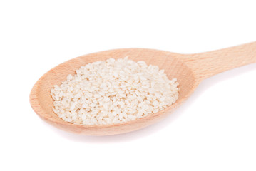 Fototapeta na wymiar Sesame seeds in a spoon isolated on white background.