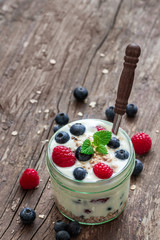Yogurt with Fresh Berries on Woden Table