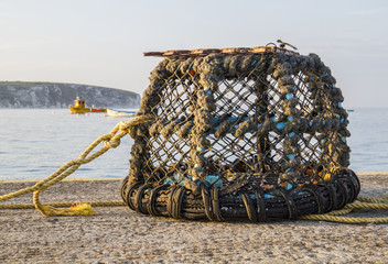 lobster pot in bay on jetty