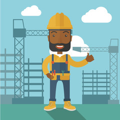 Black man standing infront of construction crane tower.