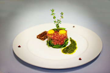 meat and raw eggs  isolated on white background