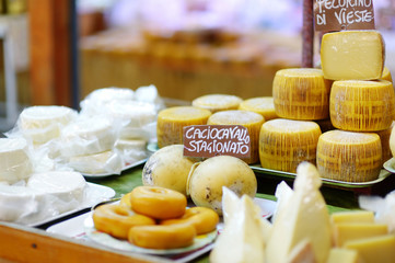 Large selection of cheeses on italian farmer market