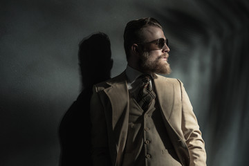 Stylish man in a three piece cream suit