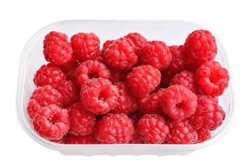 Raspberries in plastic box on white