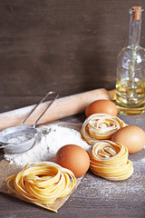 Still life of preparing pasta on rustic wooden background