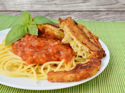 Tomato sauce with spaghetti and zucchini fritters