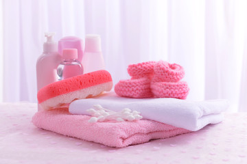 Obraz na płótnie Canvas Baby accessories for bathing on table on light background