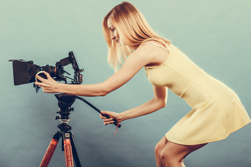 Fashion blonde girl with camera