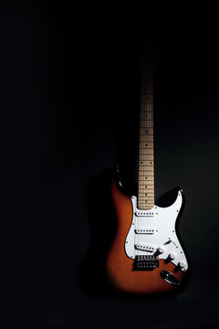 Electric guitar on black background