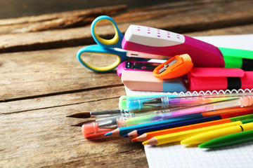 Fototapeta premium Bright school stationery on old wooden table