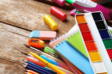Fototapeta premium Bright school stationery on old wooden table