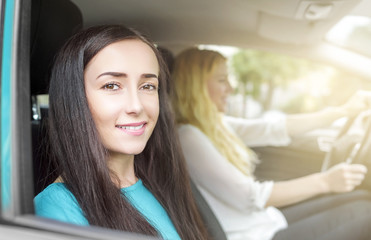 Two  girls in the car.