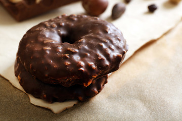 Chocolate cookie on sheet of paper, closeup