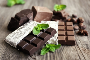 Set of spicy chocolate on wooden table, closeup