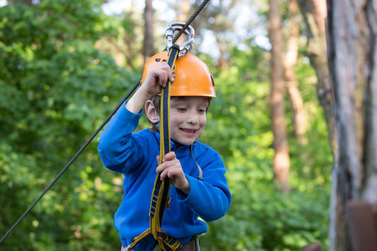 boy  climbing a rope park, Girl climbing in adventure park 