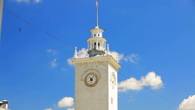 Clock Tower At Railway Station on Blue Sky Background