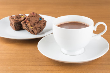a cup of chocolate with brownie