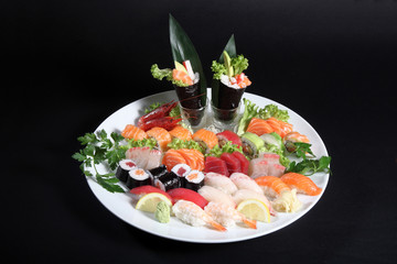 plate of sashimi and sushi