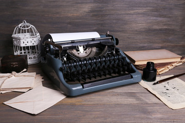 Retro typewriter on wooden background