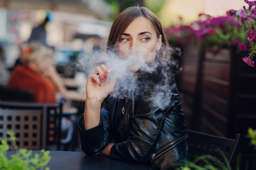 beautiful glamorous brunette smoke electronic cigarette