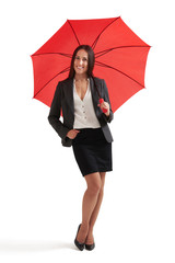 smiley woman under red umbrella