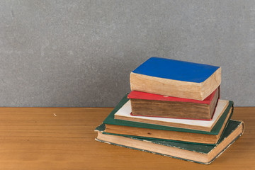 stack of old books on wood table