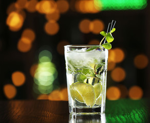 Glass of cocktails on bar background