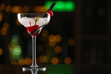 Glass of cocktails on bar background