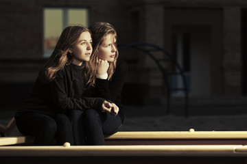 Fototapeta premium Two happy teen girls on the playground