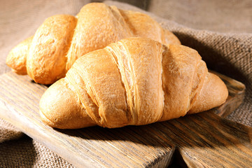 Delicious croissants on table close-up