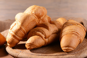 Delicious croissants on table close-up