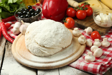 Food ingredients for pizza on table close up