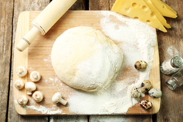 Food ingredients for pizza on table close up