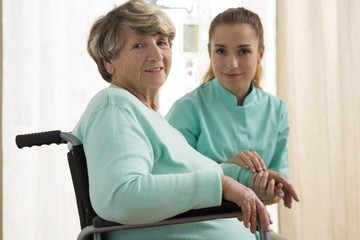 Nurse caring about senior lady