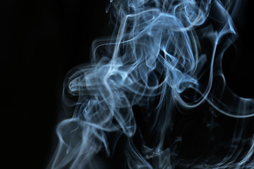Color smoke from match on dark background
