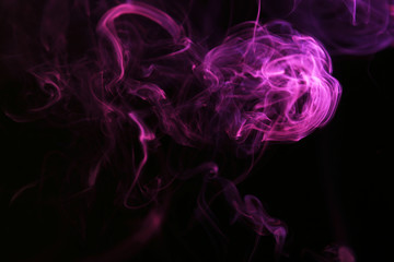 Color smoke from match on dark background