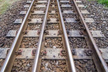 Fototapeta na wymiar railroad tracks with railroad switch, two paths come together