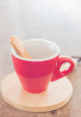 Red mug with wooden plate