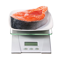 food scale with salmon fish electronic and digital isolated on w