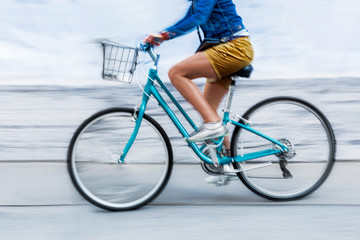 Fototapeta na wymiar cyclist in traffic on the city roadway motion blur
