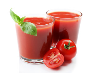 Glasses of fresh tomato juice isolated on white