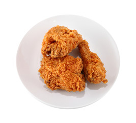 A white plate with fresh, crispy fried chicken
