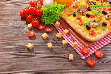 Delicious homemade pizza on table close-up