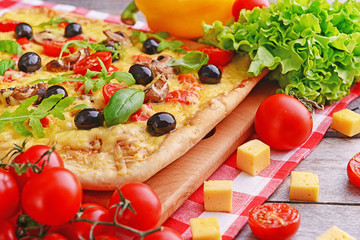 Delicious homemade pizza on table close-up