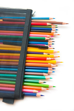 colorful of crayon wood in black bag