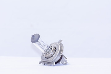 The 12V Halogen Lamp on a white background. It is light Bulb.
